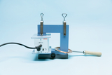Das Bild zeigt ein elektrische Gerät zur Durchführung von Experimenten, das mit einem Kupferdraht und einem Kontrollpaneel ausgestattet ist. Es ist für den Einsatz im Bildungsbereich konzipiert, um physikalische Prinzipien zu demonstrieren.
