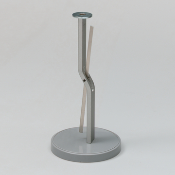 Das Bild zeigt einen stabilen Ständer aus Metall mit einem runden Sockel und zwei gebogenen Halterungen, die miteinander verbunden sind. Dieses Experimentiergerät könnte für physikalische Demonstrationen oder Tests verwendet werden.