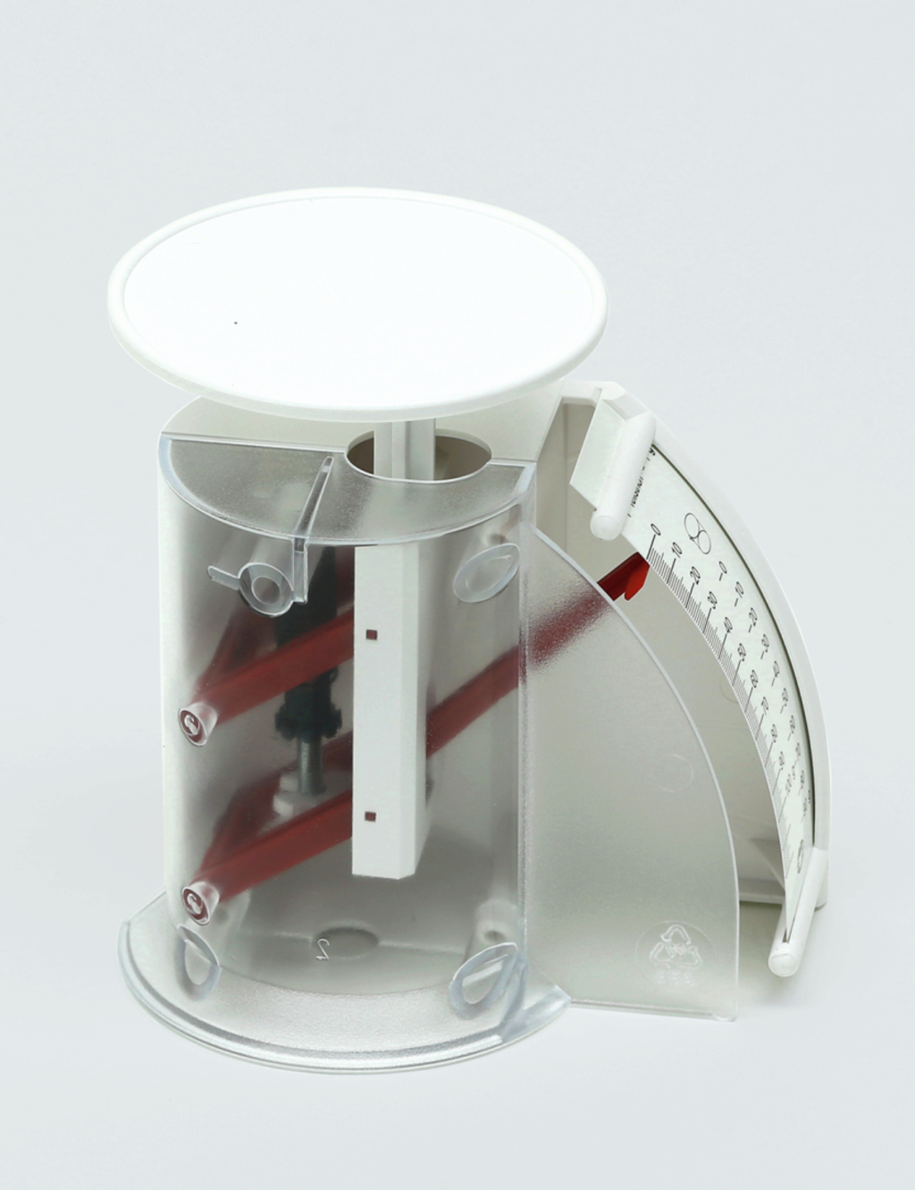 Das Bild zeigt ein transparentes, kreisförmiges Experimentiergerät mit einer weißen Plattform oben und einem drehbaren Messinstrument an der Seite. Es wird wahrscheinlich zur Durchführung von physikalischen Experimenten im Bildungsbereich verwendet.