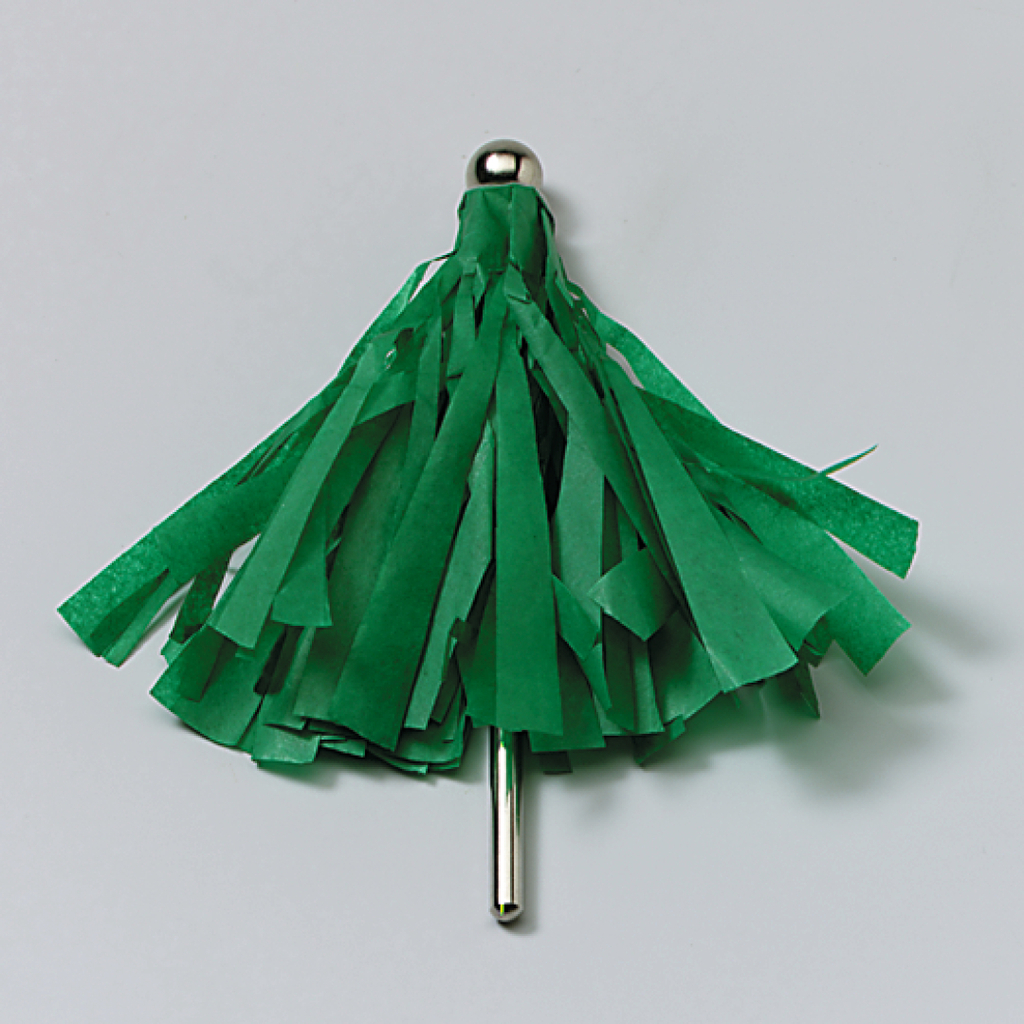 Das Bild zeigt ein Experimentiergerät in Form einer grünen Pompom ähnlichen Struktur, die aus Fransen aus Papier besteht. Es hat einen stabilen Metallstift, der als Halterung dient, und könnte für verschiedene Schulprojekte oder Physikexperimente verwendet werden.