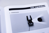Das Bild zeigt ein Experimentiergerät für optische Effekte, konkret für Schattenwürfe. Es ist auf einer Seite eines Arbeitshefts abgebildet, das sich mit dem Thema Optik befasst und zur praktischen Nutzung im Bildungsbereich dient.