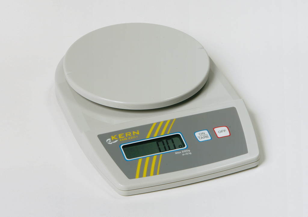 Das Bild zeigt eine digitale Laborwaage von KERN, Modell EMB 220-I, mit einem runden Wiegebehälter auf der oberen Fläche. Die Anzeige ist klar und zeigt den aktuellen Gewichtswert, während die Waage für einfache Tarierung und Bedienung ausgestattet ist.