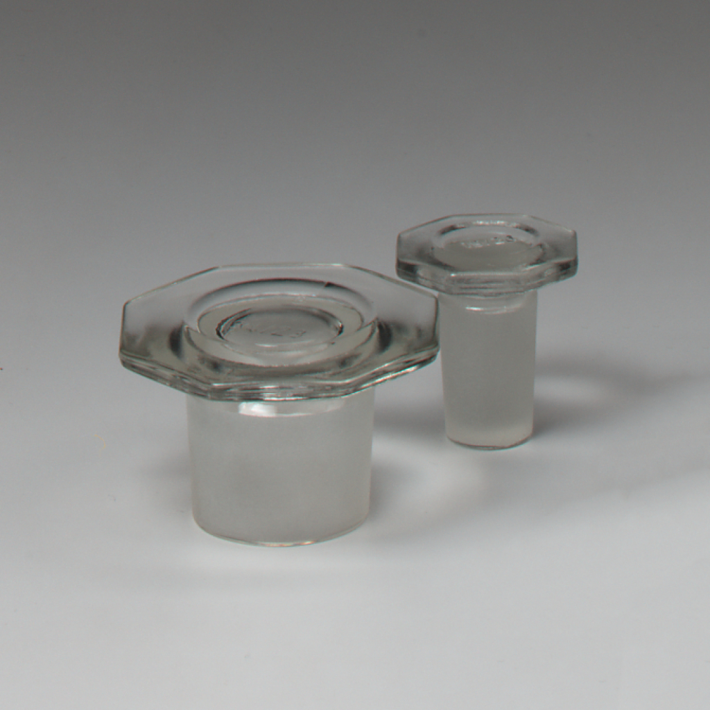 Das Bild zeigt zwei Glasartikel mit einer klaren, octagonalen Oberseite und einem frosted-bodied Fuß. Diese Behälter eignen sich wahrscheinlich für chemische Experimente oder Laboreinsätze im Bildungsbereich.