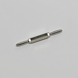 Das Bild zeigt ein metallisches Experimentiergerät mit zwei griffartigen Enden und einem zylindrischen Körper in der Mitte. Es könnte für physikalische oder chemische Experimente im Bildungsbereich verwendet werden.