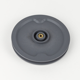 Das Bild zeigt ein graues Experimentiergerät mit einer runden Form und einer zentralen, goldenen Anschlussbuchse. Es könnte für physikalische Experimente oder wissenschaftliche Anwendungen im Bildungsbereich verwendet werden.