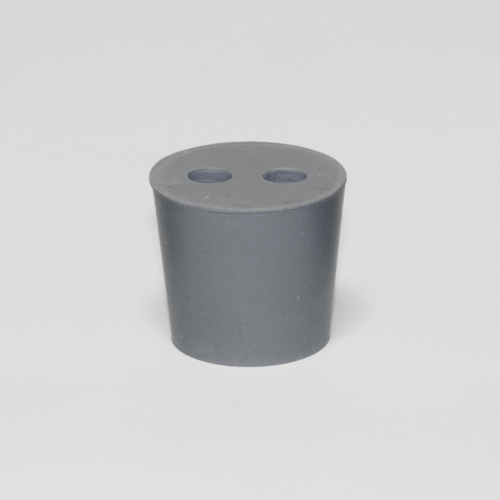 Das Bild zeigt einen grauen Kegel, der oben zwei Löcher hat. Dieses Experimentiergerät wird häufig im Bildungswesen für physikalische oder chemische Versuche eingesetzt.