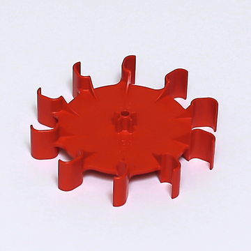 Das Bild zeigt einen rot gefärbten Kunststoffaufsatz in Form eines Sterns mit mehreren hervorstehenden Spitzen. Dieses Experimentiergerät könnte für Lern- und Bildungszwecke im naturwissenschaftlichen Unterricht eingesetzt werden.