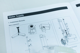 Eine Bedienungsanleitung zum Thema „Water Supply“ zeigt verschiedene technische Komponenten. Schematische Zeichnungen illustrieren den Aufbau und die Einzelteile des Versorgungsystems.